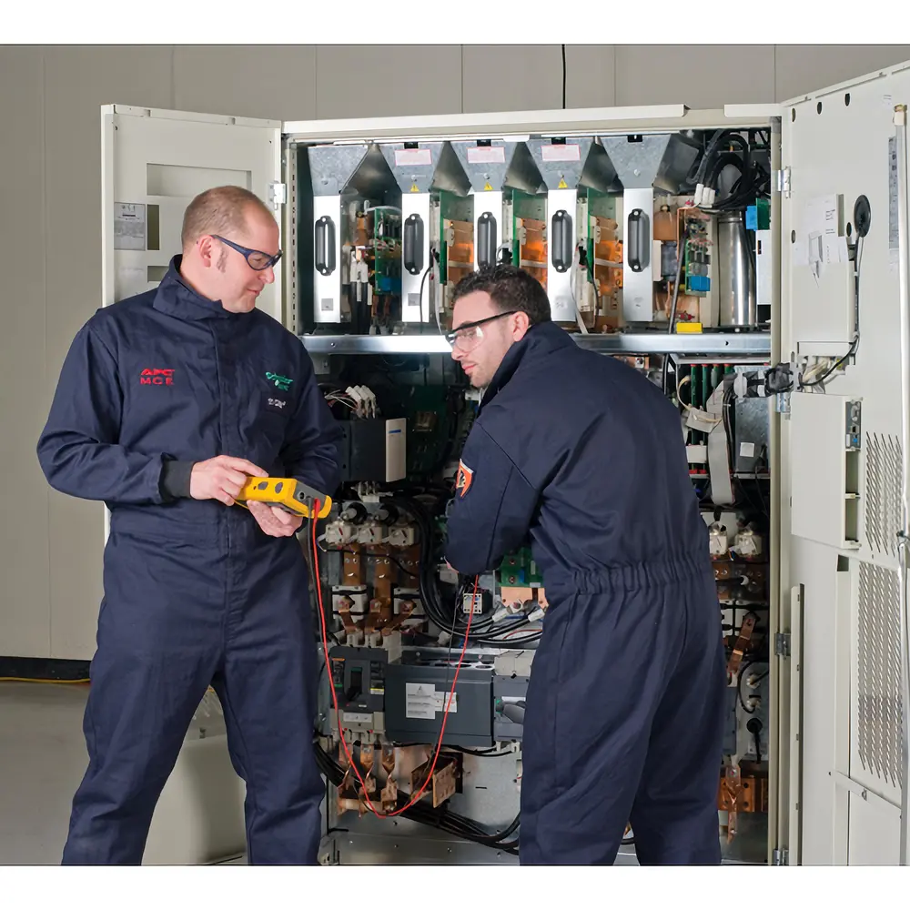 Engineers repairing industrial UPS equipment